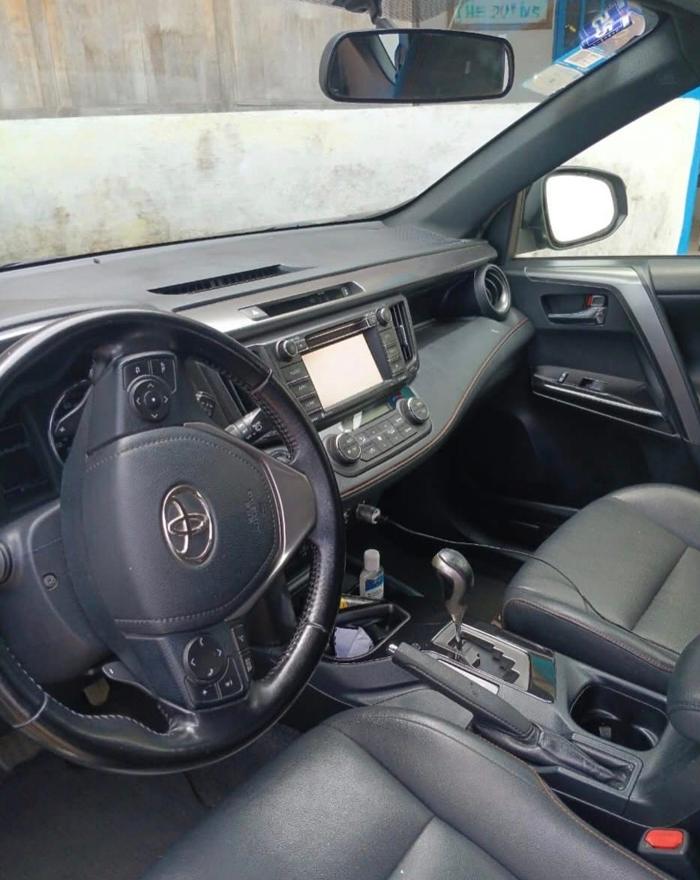 Toyota RAV4 interior showing leather seats and the dashboard